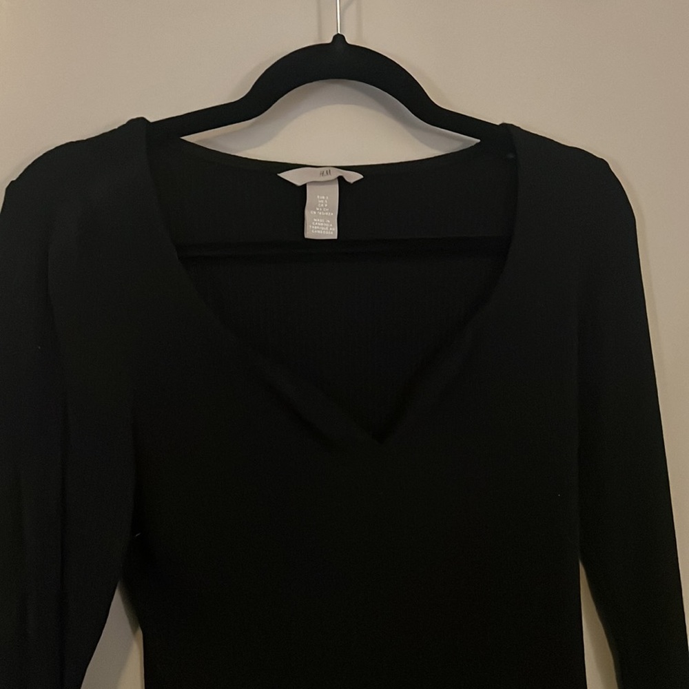 Black long sleeve with wavy neckline